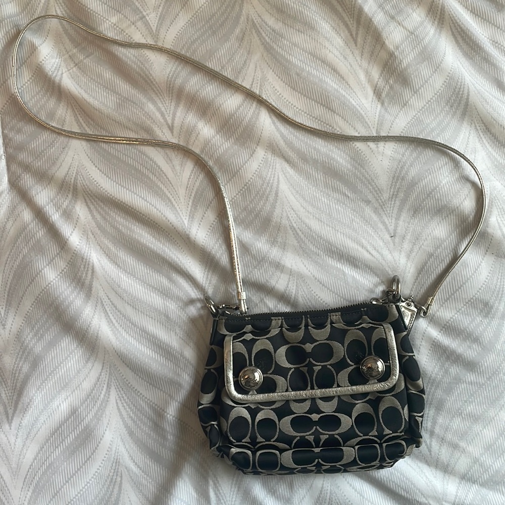 Vintage Coach side purse with metallic detailing.